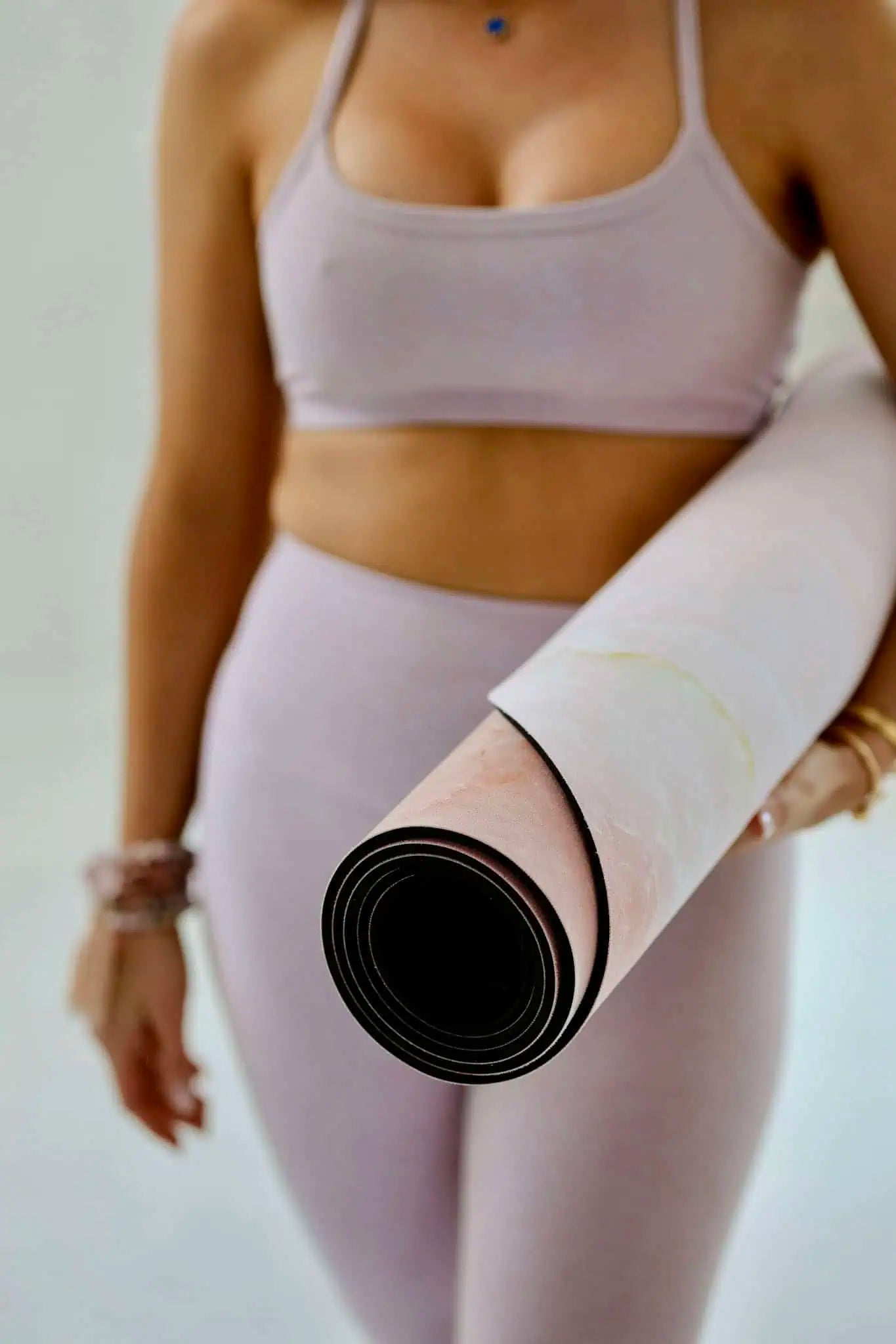 Rolled premium yoga mat with thick cushioned natural rubber base