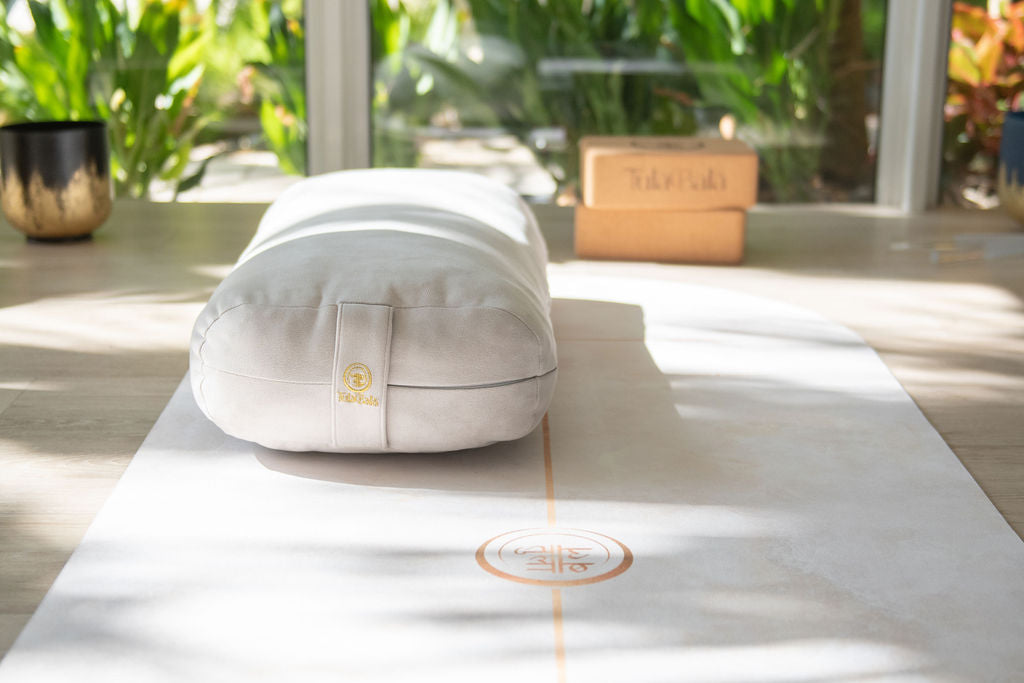 Premium yoga accessories including luxury mats, eco-friendly blocks, and bolsters crafted from natural materials.