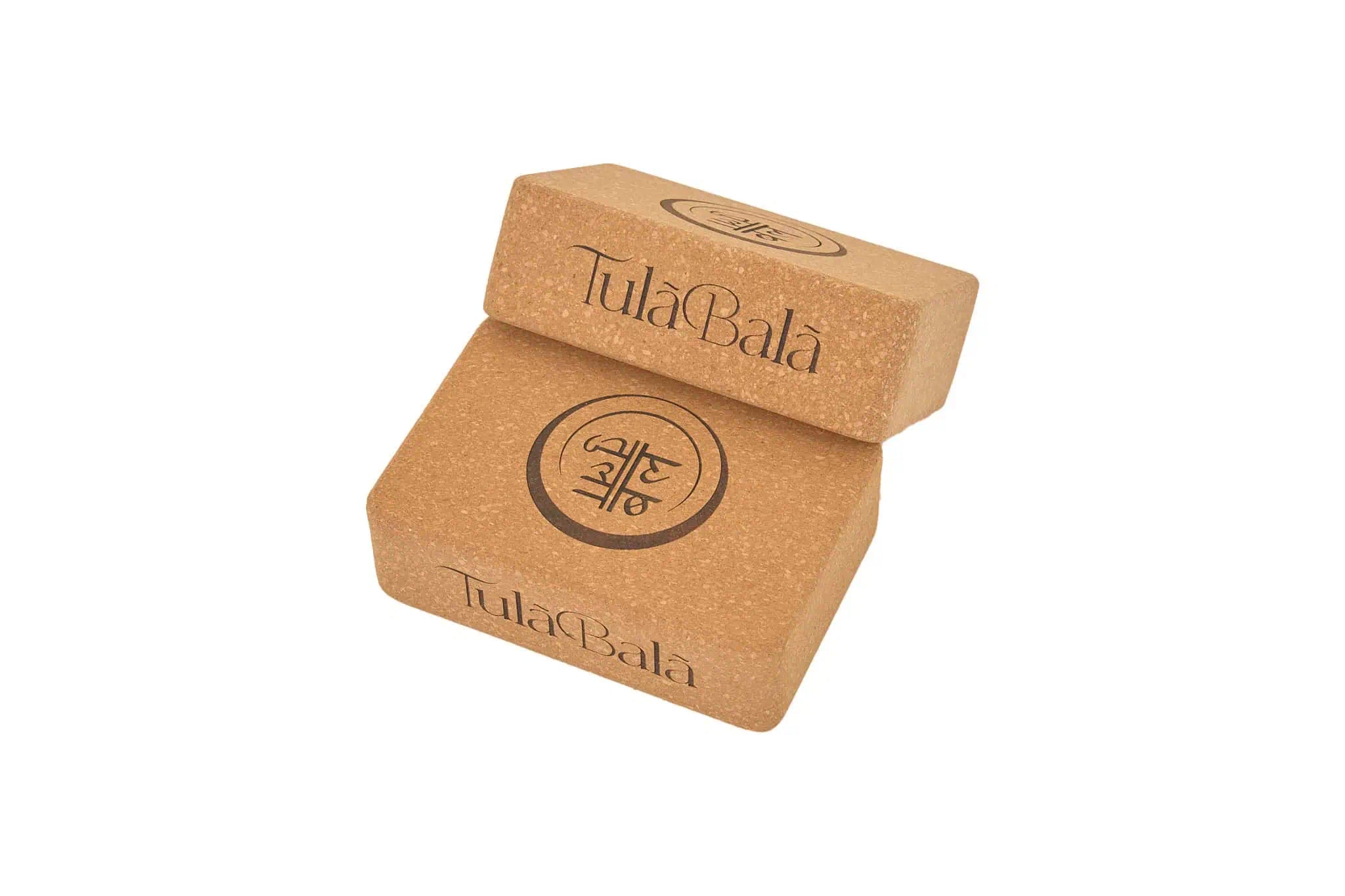 Pair of eco-friendly cork yoga blocks offering firm support for balance, stretching, and alignment during yoga and mobility sessions.