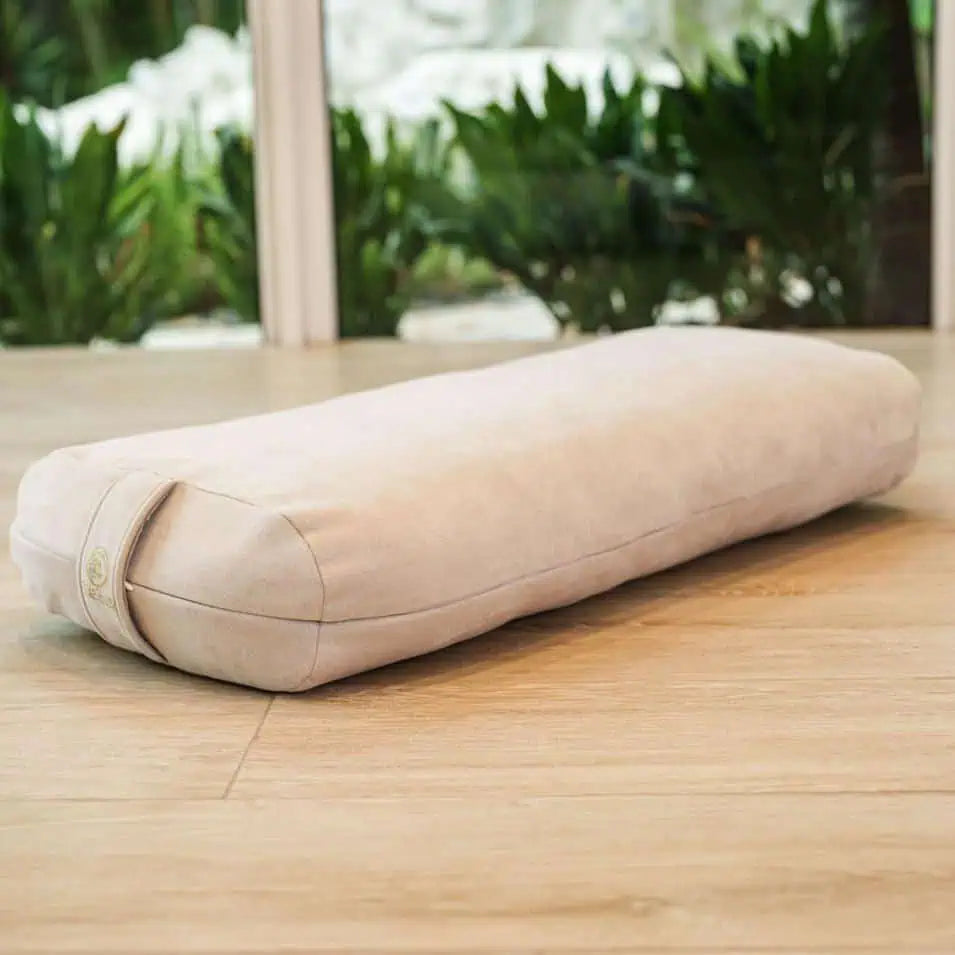 Eco friendly yoga bolster with refined aesthetic and plush filling for deep relaxation.
